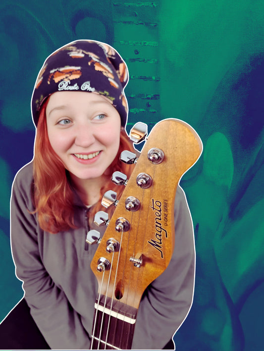 Jess Lewis with her much loved Magneto Guitar. Phase B Records.2025.